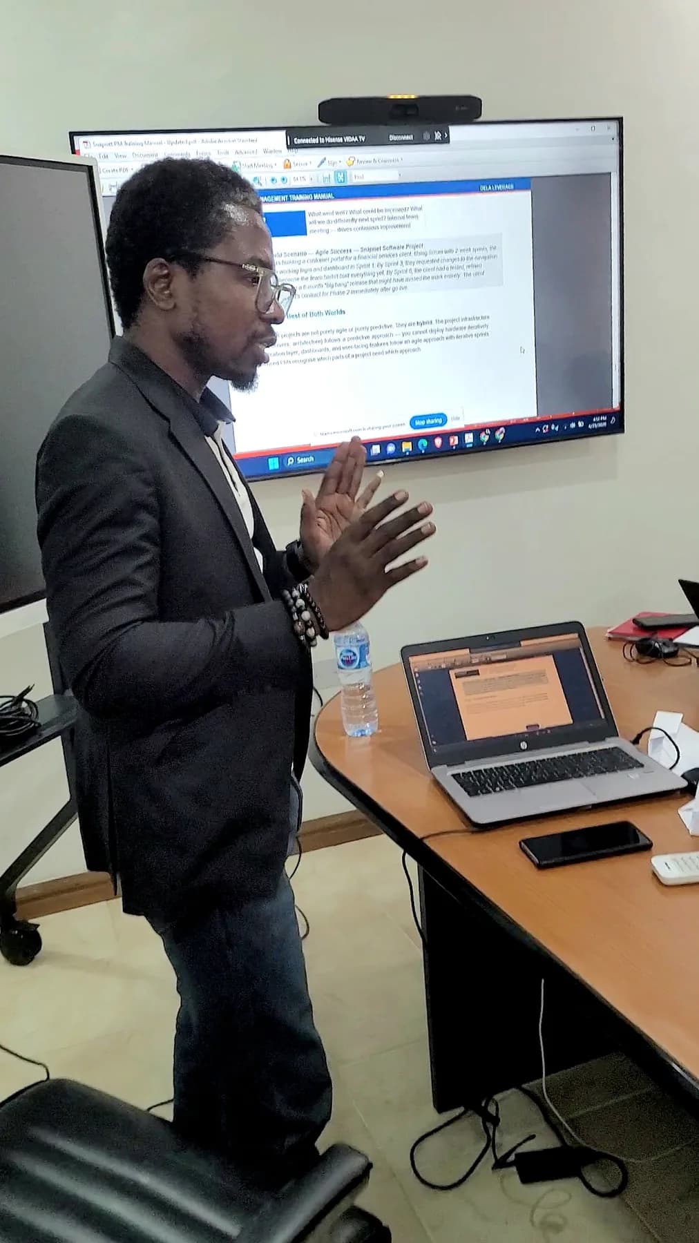 Facilitator presenting a project delivery scenario